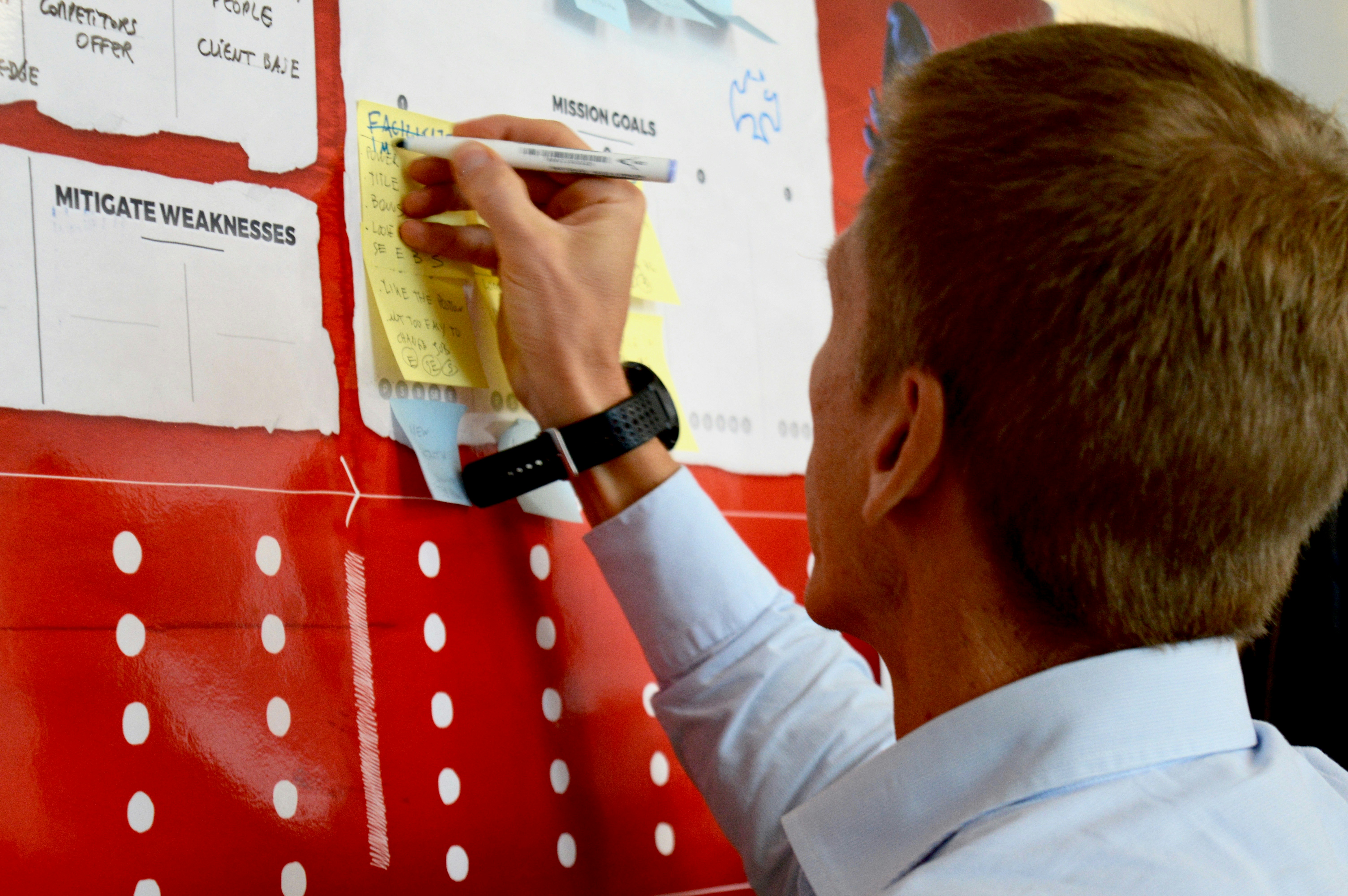Man writing on board